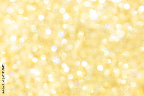 Abstract glowing yellow background, texture, glitter vintage glare, bokeh background