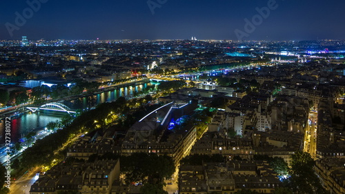 Aerial Night timelapse view of Paris City and Seine river shot on the top of Eiffel Tower © neiezhmakov
