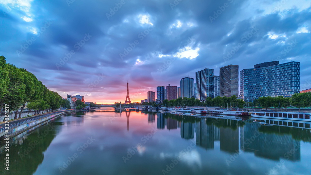 Eiffel Tower sunrise timelapse with boats on Seine river and in Paris, France.