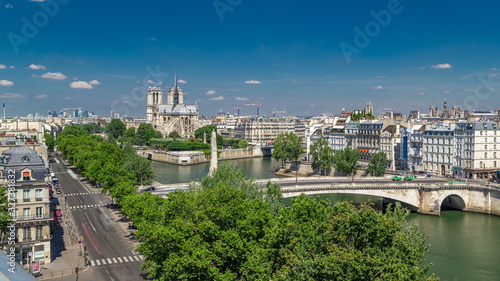 Paris Panorama with Cite Island and Cathedral Notre Dame de Paris timelapse from the Arab World Institute observation deck. France. photo