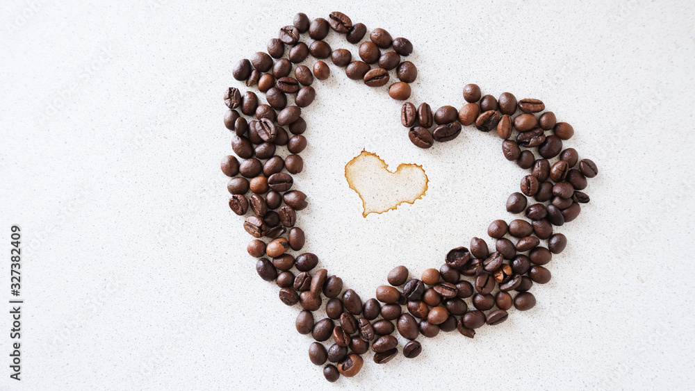coffee bean in the shape of a heart on a countertop coffee bean in the shape of a heart on a countertop