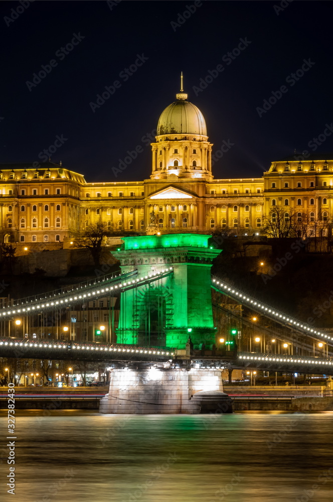 Chain Bridge with green lights on St. Patrick's day in Budapest