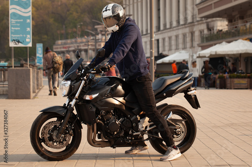 Black sports motorcycle close-up on the street.