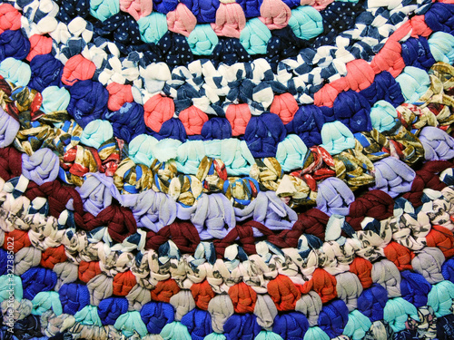  Handwork: a carpet of multi-colored shreds of fabric