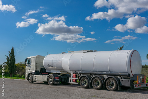 Tank truck of dangerous goods with their orange plates and danger labels