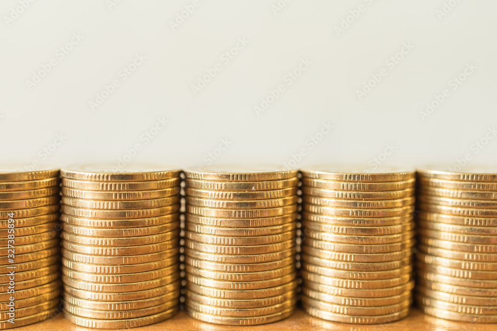 Business, Money, Finance, Security and Saving Concept. Close up of five stack of gold coins on wooden table with copy sapce. Business, Money, Finance, Security and Saving Concept. Close up of five stack of gold coins on wooden table with copy sapce.