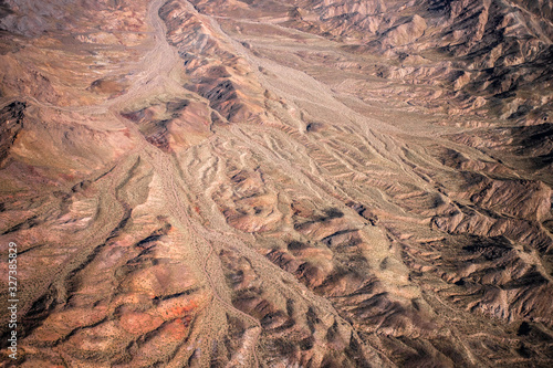 Aerial Photography over western United States with landforms, desert and mountains in view