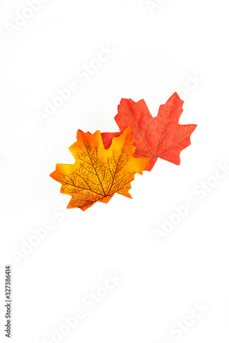 plastic artificial  maple leaf made from fabric isolated on white background