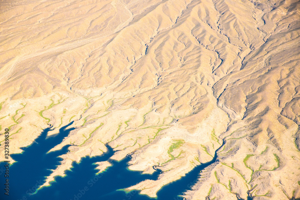 Fototapeta premium Aerial Photography over Nevada with landforms and Lake Mead in view
