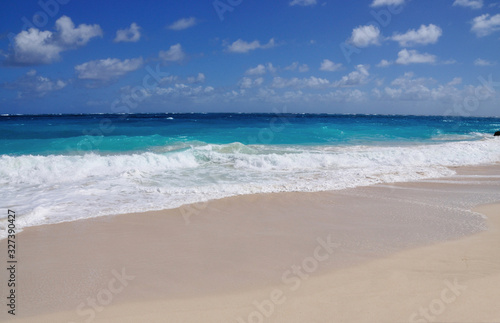 Waves crash a paradise beach