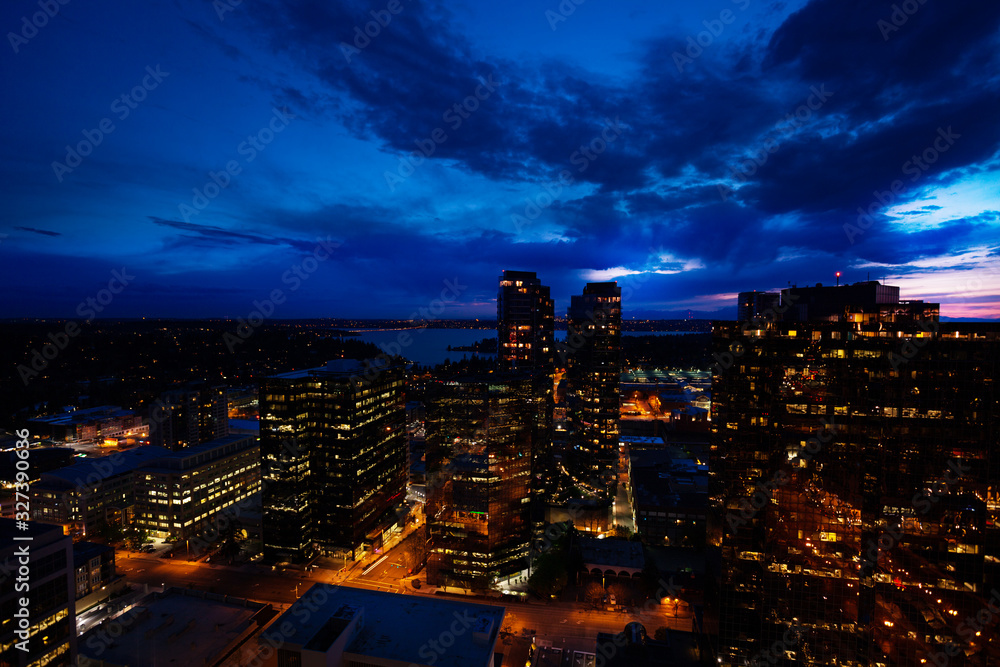 Obraz premium Night panorama of Bellevue city downtown of King County, United States across Lake Washington from Seattle