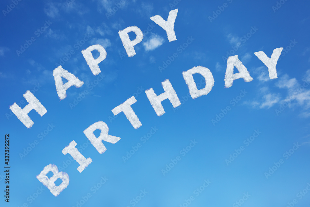 Happy birthday sign text made of clouds letters over clear day blue sky Happy birthday sign text made of clouds letters over clear day blue sky