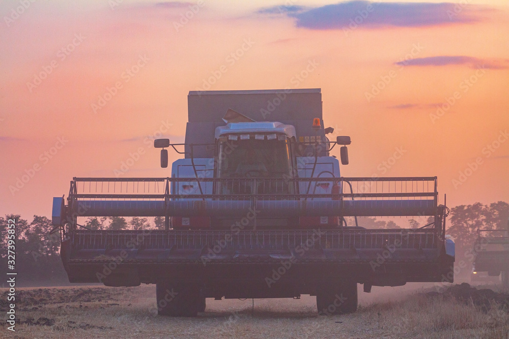 Harvesting in a wheat field combine. Harvesting in a wheat field combine.