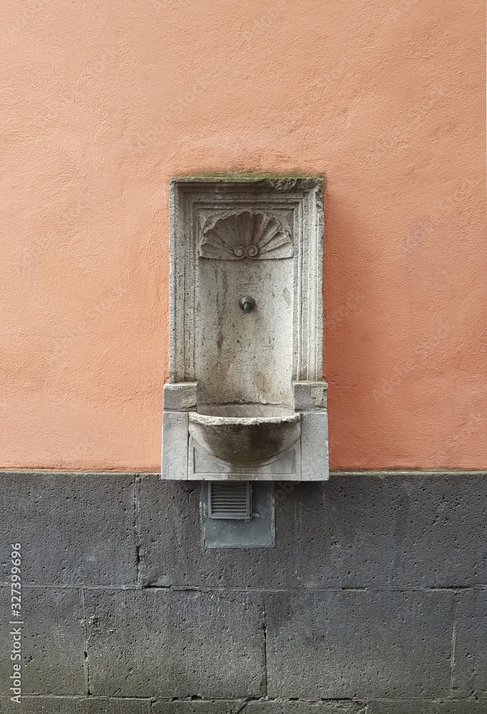 old water fountain in wall