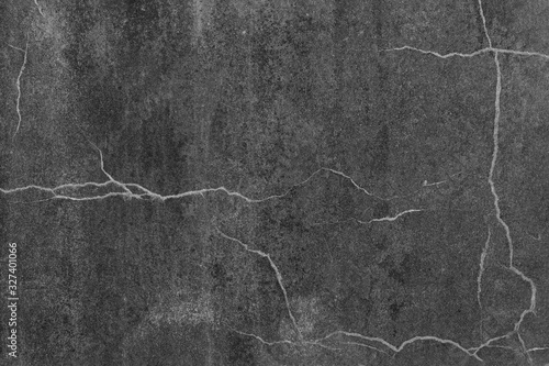 dark concrete wall with white cracks