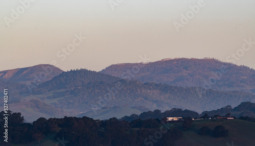 Sun rises on mountain tops in the Napa Valley © Larry D Crain