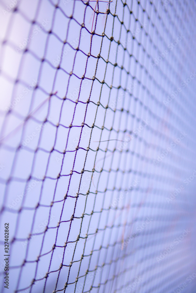fence of nets in the park to keep out intruding animals fence of nets in the park to keep out intruding animals