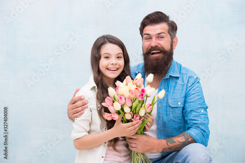 My little baby. Tender tulips for daughter. Man tulips bouquet. Father giving tulips girl. Dad with flowers. Birthday celebration. International womens day. Flower shop. Family tradition. Parenthood