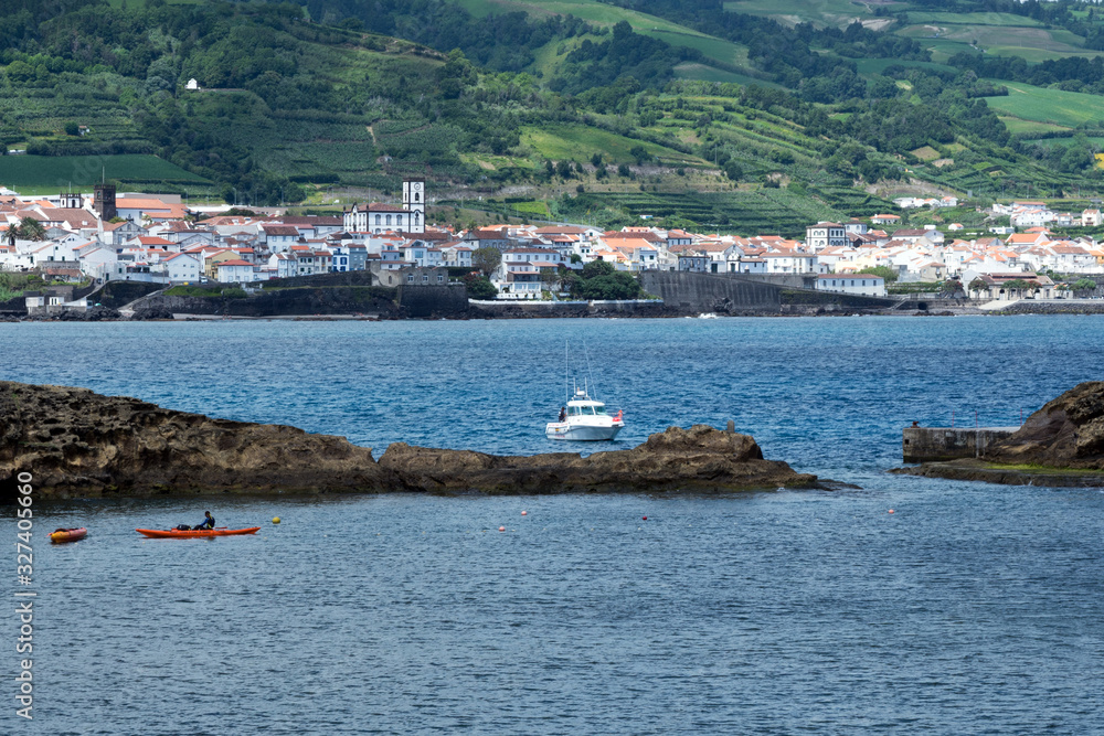 San Miguel, Portugal, June 2019. View of the beautiful village of Vila Franca do Campo on the island of San Miguel from the volcanic uninhabited island of Vila Franca, Azores. Travel to the Azores.