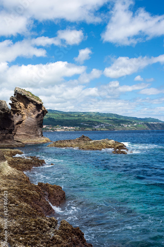 Amazing landscape in the Azores, Portugal. Large rocks against the blue sky on the uninhabited volcanic island of Vila Franca. Travel to the Azores.