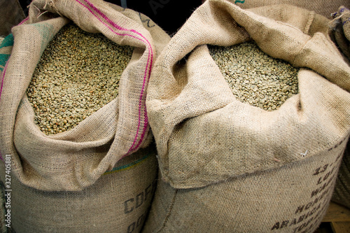 Green coffee beans in a jute bag