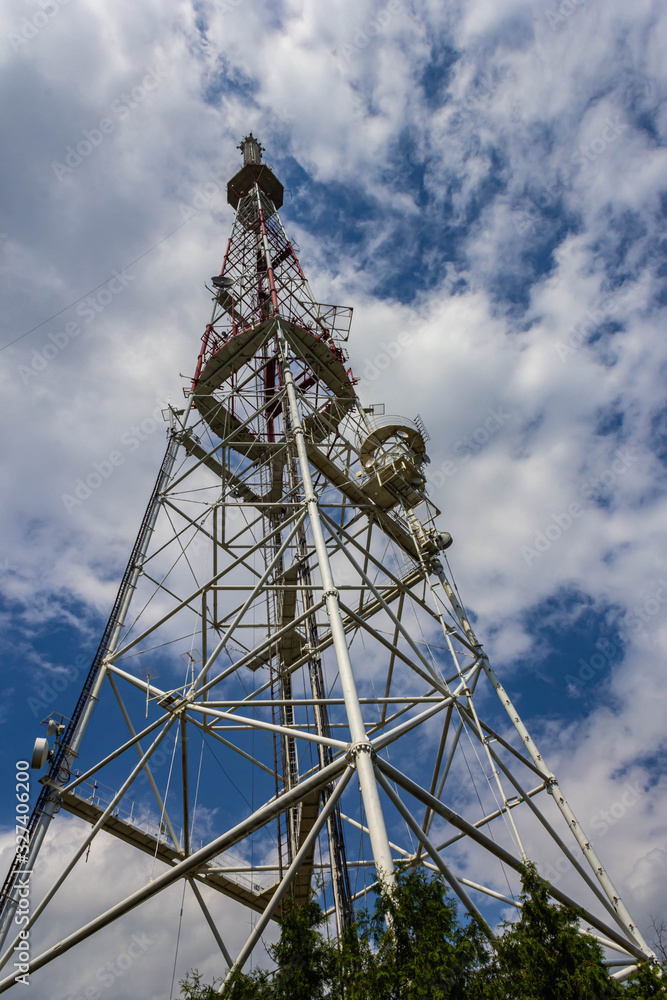 Telecommunication tower against cloudy blue sky Telecommunication tower against cloudy blue sky
