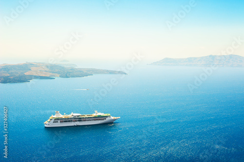 Cruise ship in the sea near Santorini island, Greece. Beautiful sea view. Famous travel destination