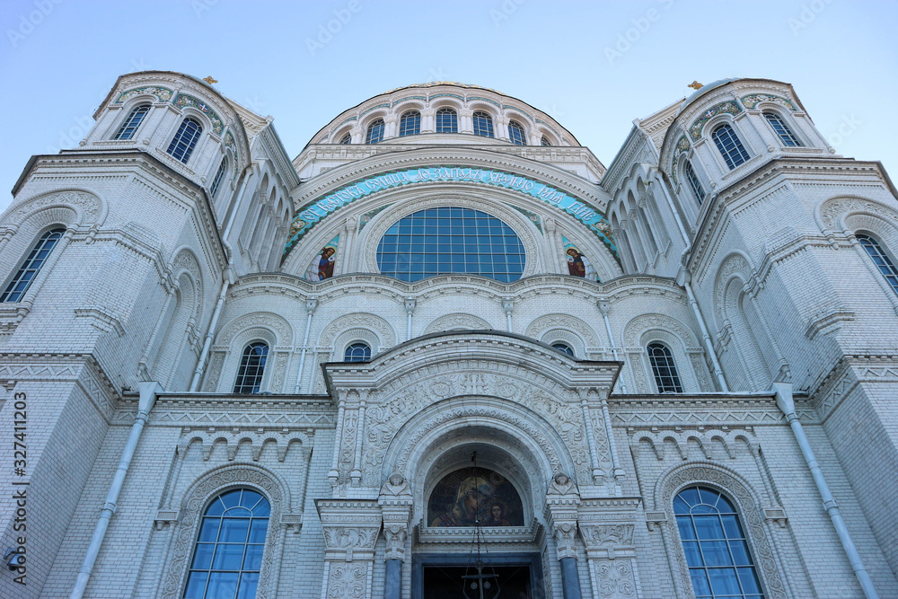 View to facade of majestic Naval cathedral of Saint Nicholas in Kronstadt, Russia from below
