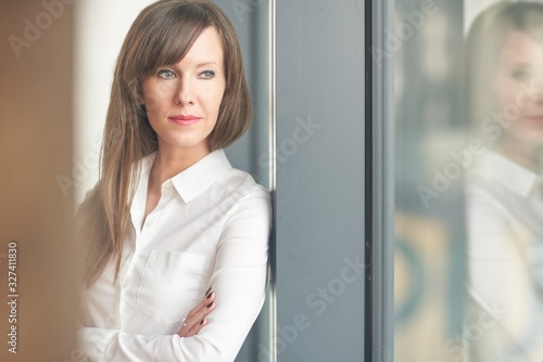 Free Download Portrait of business woman in the office. - GFXLoad