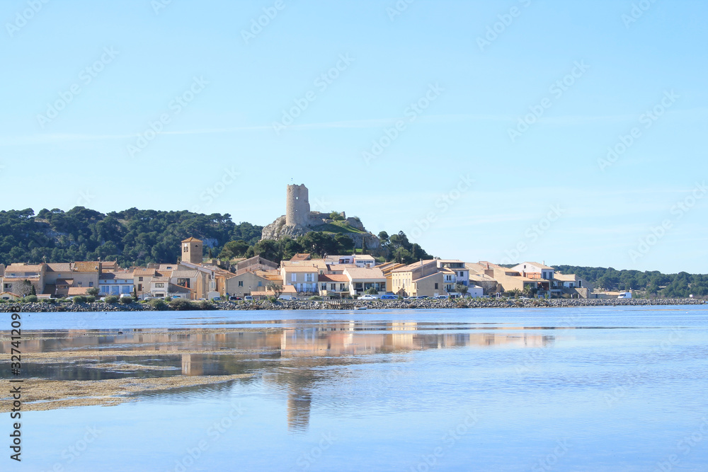 The old town of Gruissan in the heart of Regional Natural Park of Narbonne, dominated by its castle, the ruins of the Barberousse tower and its small fishermen's houses, Aude, France
