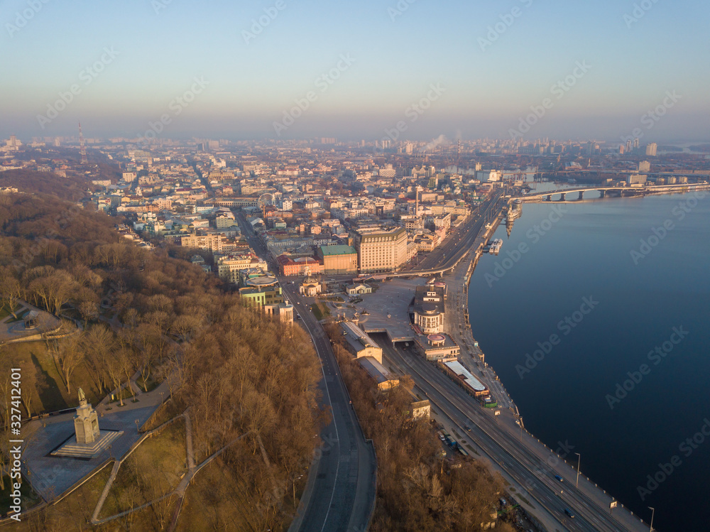 Aerial drone view. View of the Dnieper River and the Podil district in Kiev in the early morning.