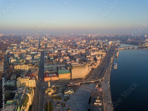 Aerial drone view. View of the Dnieper River and the Podil district in Kiev in the early morning. © Sergey