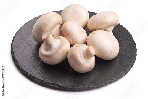 Fresh Champignon mushrooms, isolated on white background