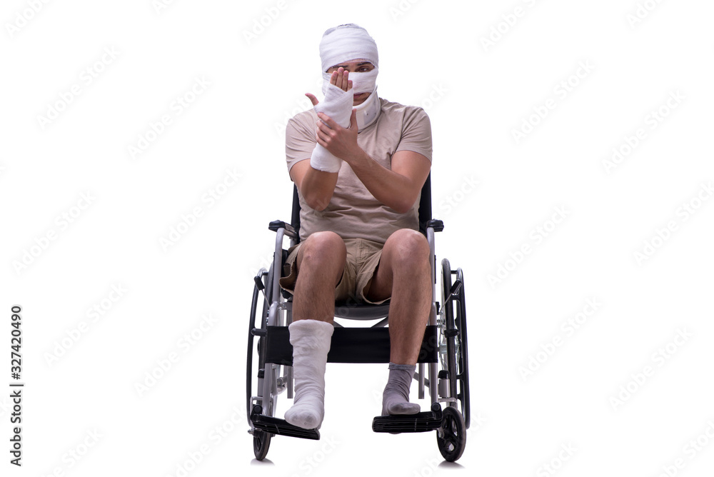 Injured man in wheel-chair isolated on white Injured man in wheel-chair isolated on white