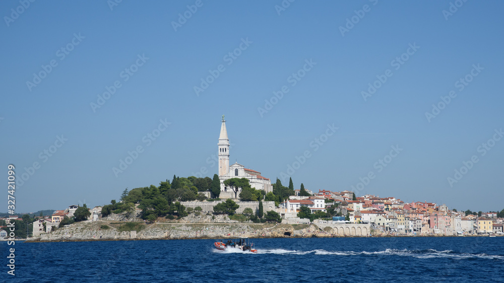 View on Rovinj city with motor boat