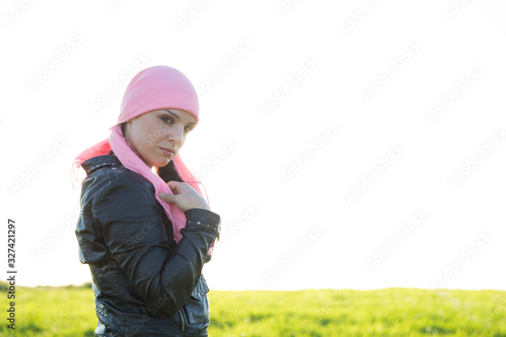 Woman with pink headscarf.