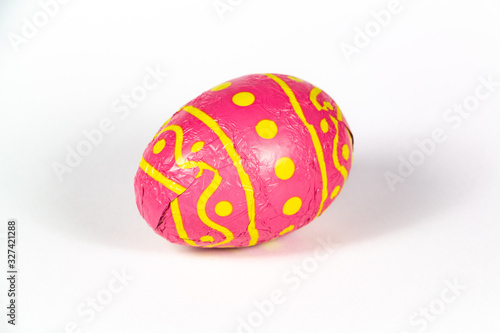 Chocolate egg wrapped in pink paper for easter