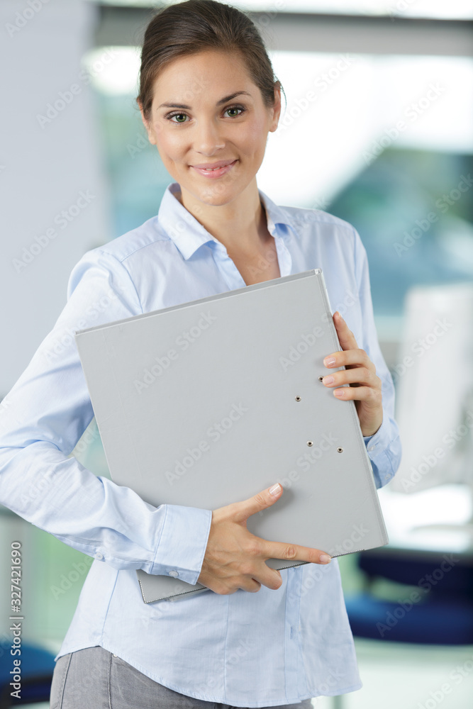 a happy woman with folder a happy woman with folder