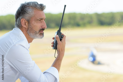 man with a walkie talkie photo