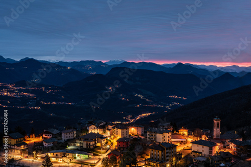 The sun rises over a small mountain village © Brambilla Simone
