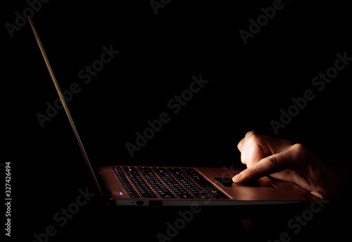 Hand on touchbar in the dark photo