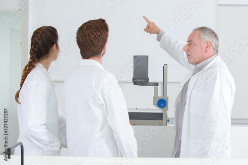 profession pointing at the white board