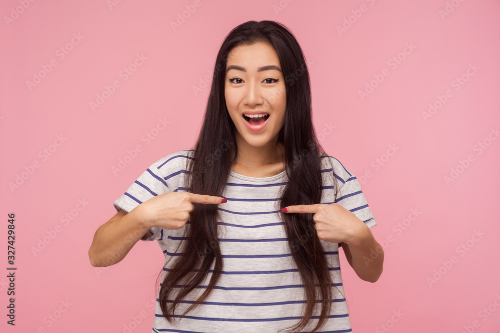 Wow, this is me! Amazed attractive girl with long hair pointing herself and looking with surprised expression, proud of own success, self-love concept. indoor studio shot isolated on pink background Wow, this is me! Amazed attractive girl with long hair pointing herself and looking with surprised expression, proud of own success, self-love concept. indoor studio shot isolated on pink background