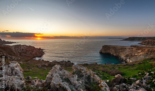 Sunset over a bay on the western coast of Malta, Europe