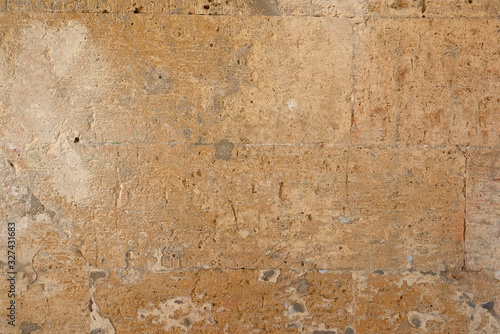 Wallpaper Mural wall of yellow rectangular stones with cement, fragment of ancient architecture Torontodigital.ca