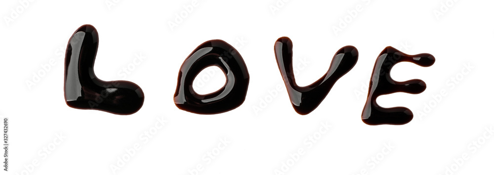 LOVE lettering painted with chocolate syrup on white background