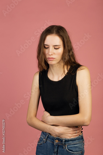 Woman in pain holding her stomach