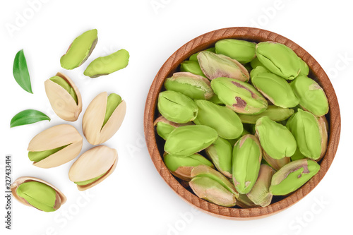 Wallpaper Mural peeled pistachio in wooden bowl isolated on white background with clipping path and full depth of field. Top view. Flat lay Torontodigital.ca