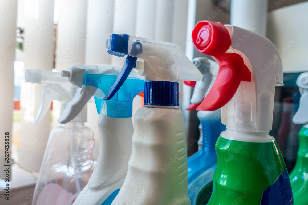 Spray bottles of cleaning products for disinfecting and making clean. - obrazy, fototapety, plakaty 