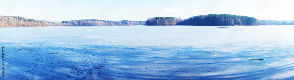 Winter landscape view of a frozen ice lake